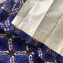 Load image into Gallery viewer, Transform any room into a vintage paradise with this pair of vibrant geometric, fully lined, pinch pleat curtain panels in bold shades of purple, blue, black, white and gold. The impeccable craftsmanship tells us they were made professionally made. An easy way to add mid mod flair and character to your home decor.
In excellent like-new condition, free from stains/tears measures 22 inches wide at the top, 40 inches wide at the bottom, 84 inches in length with a 3 1/4 inch hem. Includes 14 stainles