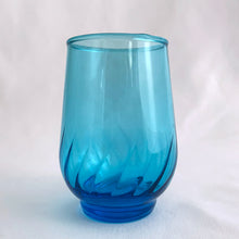 Load image into Gallery viewer, Vintage swirl optic "Regal Laser Blue" 6 ounce flat tumbler glass. Produced by the Anchor Hocking Glass Company, USA, circa 1970s. The colour of these glasses is electric! In excellent condition, free from chips/cracks. Measures 2 1/2 x 3 1/2 inches Capacity 6 ounces. We have 2 in stock, price individually.