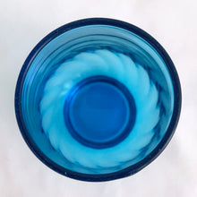 Load image into Gallery viewer, Vintage swirl optic "Regal Laser Blue" 6 ounce flat tumbler glass. Produced by the Anchor Hocking Glass Company, USA, circa 1970s. The colour of these glasses is electric! In excellent condition, free from chips/cracks. Measures 2 1/2 x 3 1/2 inches Capacity 6 ounces. We have 2 in stock, price individually.