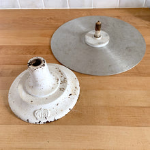 Load image into Gallery viewer, Vintage revolving cake decorating stand featuring a solid cast iron base and aluminum turntable. The base is painted off white and embossed with the initials JR inside a crown. Crafted by J. R. Mahoney for Crown Cookware, USA, 1930s. Perfect to use as intended, or to display cakes, baked good or use to create a special display of your favourite vintage treasures. A wonderful accessory for a vintage kitchen with a vintage or farmhouse theme or old fashioned bakery.
Vintage condition. 12 x 4 1/2 inches