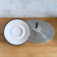 Load image into Gallery viewer, Jacks Daughter of All Trades Vintage Antique Mid-Century Kitsch Store Shop Reseller Etsy Shopify Toronto Canada Free Porch Pick Up Local Delivery Worldwide Shipping Judy Weinberg Unique Sustainable Gift Home Decor Collector Gift Farmhouse Cottagecore Cottage Lodge Shabby Chic Industrial revolving cake stand cast iron base and steel turntable. The base is painted in a putty colour and embossed with the initials JR inside a crown. JR Mahoney for Crown Cookware USA 1930s display old fashioned bakery kitchen