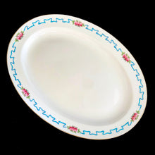 Load image into Gallery viewer, Vintage "Ribbon and Blossom" porcelain serving platter, featuring a blue ribbon and pink flower detail around the outer lip with gold gilt rim. Crafted by Royal Minton, England. A lovely serving piece for generations to come! In good vintage condition, no chips/cracks/repairs, minor wear to the gold. Marked with the Mintons pink stamp, and Ryrie Bros Limited, Toronto. Measures 13 1/4 x 9 1/2 inches