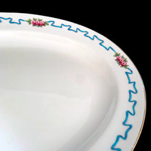 Load image into Gallery viewer, Vintage "Ribbon and Blossom" porcelain serving platter, featuring a blue ribbon and pink flower detail around the outer lip with gold gilt rim. Crafted by Royal Minton, England. A lovely serving piece for generations to come! In good vintage condition, no chips/cracks/repairs, minor wear to the gold. Marked with the Mintons pink stamp, and Ryrie Bros Limited, Toronto. Measures 13 1/4 x 9 1/2 inches
