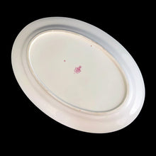 Load image into Gallery viewer, Vintage "Ribbon and Blossom" porcelain serving platter, featuring a blue ribbon and pink flower detail around the outer lip with gold gilt rim. Crafted by Royal Minton, England. A lovely serving piece for generations to come! In good vintage condition, no chips/cracks/repairs, minor wear to the gold. Marked with the Mintons pink stamp, and Ryrie Bros Limited, Toronto. Measures 13 1/4 x 9 1/2 inches