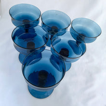 Load image into Gallery viewer, Angled overhead view of full set of six vintage Richmond Blue champagne glasses by Colony Glass showing excellent condition and retro barware appeal
