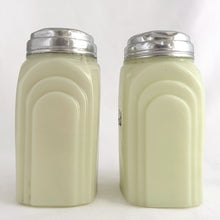 Load image into Gallery viewer, Vintage "Roman Arch" custard uranium glass salt and pepper shaker with the words Salt and Pepper in crisp black script. Produced by McKee Glass, USA, 1930 - 1951. These art deco beauties glow brilliantly under black light and will make a great addition to any vintage kitchen collection!