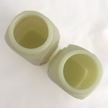Load image into Gallery viewer, Vintage "Roman Arch" custard uranium glass salt and pepper shaker with the words Salt and Pepper in crisp black script. Produced by McKee Glass, USA, 1930 - 1951. These art deco beauties glow brilliantly under black light and will make a great addition to any vintage kitchen collection!