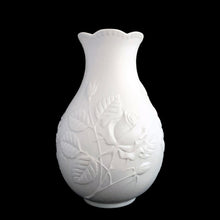Load image into Gallery viewer, Vintage Rose white bisque flower vase, 635, featuring embossed roses and scalloped edge. Designed by M. Frey for Kaiser, Germany, 1980s. This delicate bottle shaped vase will look stunning in any setting!
In excellent condition, no chips/cracks/repairs. Maker's mark on bottom.
Measures 4 x 4 x 7 1/8 inches