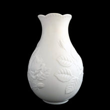 Load image into Gallery viewer, Vintage Rose white bisque flower vase, 635, featuring embossed roses and scalloped edge. Designed by M. Frey for Kaiser, Germany, 1980s. This delicate bottle shaped vase will look stunning in any setting!
In excellent condition, no chips/cracks/repairs. Maker's mark on bottom.
Measures 4 x 4 x 7 1/8 inches