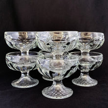 Load image into Gallery viewer, Libbey Glass Company nostalgic clear pressed glass ice cream parlour dishes in stock. They have a quintessential round paneled shape featuring a flared foot impressed basketweave pattern plus the stylized Libbey L on the bottom. Circa 1950s. Perfect for adding a nostalgic touch to desserts - a must-have for all ice cream and dessert lovers! In excellent condition, free from chips/cracks. Measures 3 3/8 x 3 inches. Capacity 4 3/4 ounces