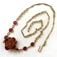 Load image into Gallery viewer, Vintage 1980s Swarovski ruby red crystal flower necklace with gold-tone chain displayed flat showing the back of the flower and full 19.5 inch length