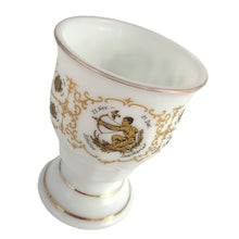 Load image into Gallery viewer, Unusual vintage milk glass goblet bearing the signs of the zodiac horoscope, featuring two medallions with the symbol and dates of the "Sagittarius" sign in both English and German. Graphics of the remaining zodiac signs appear on the sides of the gold rimmed goblet. Crafted in Germany.