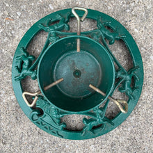 Load image into Gallery viewer, Get ready to put up the Christmas tree using this gorgeous cast iron stand in hunter green, decorated with Santa Claus in his sleigh with reindeer! The perfect addition to your vintage or modern Christmas decor.
In used vintage condition.
Dimensions: 14 inch diameter, reservoir measures 6 1/4 x 4 1/4 inches