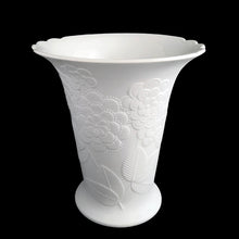 Load image into Gallery viewer, Vintage Sardinia white bisque flower footed trumpet vase features an embossed bouquet of flowers and semi-scalloped rim. Marked 642. Designed by M. Frey for Kaiser, Germany, 1980s. This delicate vase will look stunning in any setting!
In excellent condition, no chips/cracks/repairs. Maker's mark on bottom.
Measures 5 5/8 x 5 3/4 x 6 1/4 inches