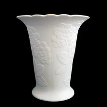 Load image into Gallery viewer, Vintage Sardinia white bisque flower footed trumpet vase features an embossed bouquet of flowers and semi-scalloped rim. Marked 642. Designed by M. Frey for Kaiser, Germany, 1980s. This delicate vase will look stunning in any setting!
In excellent condition, no chips/cracks/repairs. Maker's mark on bottom.
Measures 5 5/8 x 5 3/4 x 6 1/4 inches