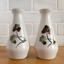 Load image into Gallery viewer, A lovely set of vintage ceramic stoneware salt and pepper shakers in the "Shamrock" pattern featuring shades of green, blue and brown on a light gray ground. Crafted by Denby-Langely, England, between 1954 - 1981. Spice up your life! In excellent condition, free from chips. New corks. Measures 2 1/4 x 4 1/2 inches