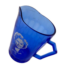 Load image into Gallery viewer, Close-up of Shirley Temple white silhouette and signature on cobalt blue Depression glass creamer, 1930s Hazel-Atlas
