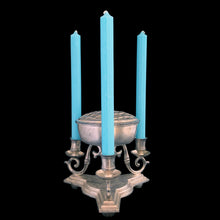 Load image into Gallery viewer, Vintage silver-toned cast metal centrepiece, features three gracefully curved arms to hold taper candles surrounding a central bowl fitted with a removable flower frog insert. Popular throughout the early to mid-20th century, this style of centerpiece blends classic form with practical design. Perfect for creating a striking focal point for dining tables, sideboards, or special occasions. Whether styled with seasonal blooms or displayed on its own, this centerpiece adds instant character and old-world charm