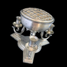 Load image into Gallery viewer, Vintage silver-toned cast metal centrepiece, features three gracefully curved arms to hold taper candles surrounding a central bowl fitted with a removable flower frog insert. Popular throughout the early to mid-20th century, this style of centerpiece blends classic form with practical design. Perfect for creating a striking focal point for dining tables, sideboards, or special occasions. Whether styled with seasonal blooms or displayed on its own, this centerpiece adds instant character and old-world charm