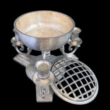 Load image into Gallery viewer, Vintage silver-toned cast metal centrepiece, features three gracefully curved arms to hold taper candles surrounding a central bowl fitted with a removable flower frog insert. Popular throughout the early to mid-20th century, this style of centerpiece blends classic form with practical design. Perfect for creating a striking focal point for dining tables, sideboards, or special occasions. Whether styled with seasonal blooms or displayed on its own, this centerpiece adds instant character and old-world charm