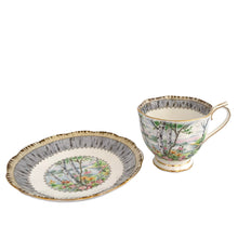 Load image into Gallery viewer, Vintage "Silver Birch" porcelain teacup and saucer. Crafted by Royal Albert, England, 1935 - 1945. This beautiful pattern consists of lakeside woodland scene of birch trees and colourful flowers surrounded with a border of rustic gray and cream, rimmed in gold gilt. In excellent condition, free from chips/cracks/repairs.