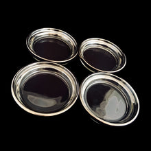 Load image into Gallery viewer, Angled top detail of the four stackable silver fade glass coasters with textured bottoms.