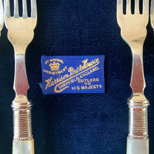 Load image into Gallery viewer, Antique EPNS silver plate fork and knife set featuring Mother-of-Pearl handles with locking royal blue velvet lined golden oak wood box, includes 3 keys. Crafted by Harrison Brothers & Howson, England, circa 1890s. A gorgeous set of cutlery perfect for dessert and fruit service.
In excellent vintage condition, freshly polished. Phillips Montreal appraisal certificate included.
Fork measures 6 1/8 inches
Knife measures 7 1/2 inches
Box measures 11 1/4 x 9 1/4 inches