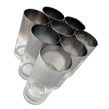 Load image into Gallery viewer, Overhead angled view of silver fade highball tumblers showing mirrored silver rims and clear glass bases