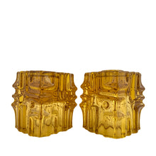 Load image into Gallery viewer, Stunning pair of vintage mid-century brutalist style amber candle holders. Versatile, may be used with tapers or votive candles. Designed by artisan Vladislav Urban for Sklo Union, Rosice Glassworks, Czechoslovakia, circa 1968. A gorgeous way to add glow to your life!
In excellent condition, free from chips/cracks.
Measures 2 3/8 x 2 3/8 x 3 1/8 inches