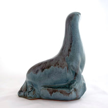Load image into Gallery viewer, Vintage seal perched on rocks redware figurine, finished in slate blue drip glaze with a matte finish. Crafted by Blue Mountain Pottery, Canada, circa 1970s. A beautiful and highly collectible piece of pottery from this iconic brand! Excellent condition, free from chips/cracks/repairs. Measures 5 3/4 x 4 x 7 1/2 inches