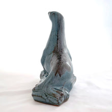 Load image into Gallery viewer, Vintage seal perched on rocks redware figurine, finished in slate blue drip glaze with a matte finish. Crafted by Blue Mountain Pottery, Canada, circa 1970s. A beautiful and highly collectible piece of pottery from this iconic brand! Excellent condition, free from chips/cracks/repairs. Measures 5 3/4 x 4 x 7 1/2 inches