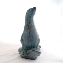 Load image into Gallery viewer, Vintage seal perched on rocks redware figurine, finished in slate blue drip glaze with a matte finish. Crafted by Blue Mountain Pottery, Canada, circa 1970s. A beautiful and highly collectible piece of pottery from this iconic brand! Excellent condition, free from chips/cracks/repairs. Measures 5 3/4 x 4 x 7 1/2 inches