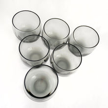 Load image into Gallery viewer, Overhead top view of vintage 1960s Libbey roly poly glasses in smokey gray, heavily weighted barware