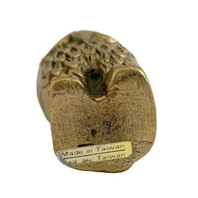 Load image into Gallery viewer, Underside of vintage solid brass owl figurine showing original bilingual "Made in Taiwan / Fait au Taiwan" sticker, 1970s