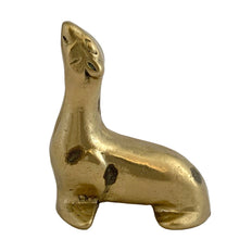 Load image into Gallery viewer, Left-side profile of vintage solid brass seal figurine in upright seated pose, face detail and aged patina visible, 1970s Taiwan