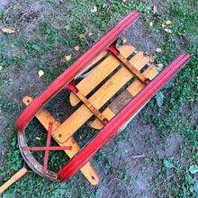 Load image into Gallery viewer, Classic vintage mid-century Spartan child's pull snow sleigh or sled. This one features a steel frame with red metal skis, wood slat deck and steering bar, metal backrest and long wood handle with red metal hand grip. Crafted by Werlich Industries, Canada, 1960s. Bring back all the wonderful of snowy winter days with this beloved wee sled!
In as found vintage condition with wear to the entire piece commensurate with use and age. Original sticker present.