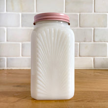 Load image into Gallery viewer, Vintage milk glass shaker featuring an pressed starburst pattern. Produced by McKee Glass, circa 1950. Beautiful art deco design to add to your shaker collection and tableware. In excellent condition, free from chips. Metal lid may have been repainted. 2 3/8 x 2 3/8 x 4 1/2 inches