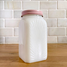 Load image into Gallery viewer, Vintage milk glass shaker featuring an pressed starburst pattern. Produced by McKee Glass, circa 1950. Beautiful art deco design to add to your shaker collection and tableware. In excellent condition, free from chips. Metal lid may have been repainted. 2 3/8 x 2 3/8 x 4 1/2 inches