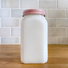 Load image into Gallery viewer, Vintage milk glass shaker featuring an pressed starburst pattern. Produced by McKee Glass, circa 1950. Beautiful art deco design to add to your shaker collection and tableware. In excellent condition, free from chips. Metal lid may have been repainted. 2 3/8 x 2 3/8 x 4 1/2 inches