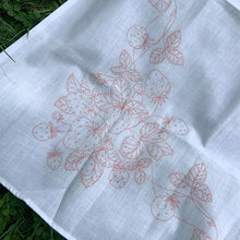 Load image into Gallery viewer, Vintage white cotton tablecloth with a stamped pattern of strawberries and vines. These Bucilla kit tablecloths were intended to be painted with Tri-Chem Liquid Embroidery pens, but can easily be stitched with embroidery floss to create a beautiful table covering. In excellent condition, no stains/tears. Measures 54 x 69 inches
