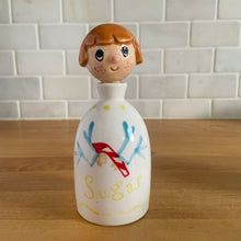 Load image into Gallery viewer, Vintage "Sugar and Spice and Everything Nice" decanters and jar lid. Created by Earl Bernhard and made in Japan. Sweet decorative ceramics! Sugar and Spice decanter jars measure 2 1/8 x 5 1/4 Everything Nice lid measures 2 1/4 x 3 1/8 (chip to underside of rim)