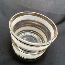 Load image into Gallery viewer, Side angle of 1950s frosted glass ice bucket with graduating gold stripes