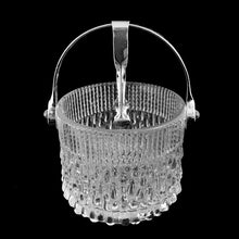 Load image into Gallery viewer, Vintage "TF14" clear pressed glass ice bucket with a texture reminiscent of melting ice with silver toned metal handle and tongs. Crafted exclusively for Teleflora, France, 1970s, tongs marked "USA". This beautiful ice bucket will add sparkle to your bar cart and cocktail service!
In excellent condition, no chips.
Measures 5 x 4 7/8 inches