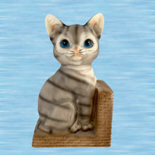 Load image into Gallery viewer, Vintage kitschy tabby cat ceramic bookend with blue eyes on basketweave base, Japan 1950s–60s — front view