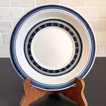 Load image into Gallery viewer, Vintage Saucer in the Tangier pattern. Features a Moroccan-style geometric floral pattern in shades of purple, green, and deep blue on a light gray ground. Lambeth Stoneware. Overall excellent condition, free from chips/cracks with normal age-related wear. The exception is the Casserole with a chip to the rim and underside of one handle. Marked "Lambeth Stoneware, Royal Doulton, Tangier, L.S.1005, Made in England, Dishwasher Proof, Detergent Proof, Freezer & Oven Proof, © 1973.
