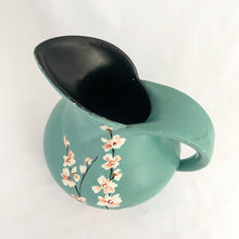 Load image into Gallery viewer, Vintage art deco style teal pitcher vase, hand painted with branches and pink flower blossoms, glazed black on the interior. Produced by Brentleigh Ware, England, circa 1930s. This small pitcher has big style with strong lines! In great vintage condition, free from chips/cracks/repairs, very minor glaze loss on the rim and handle. Marked "Brentleigh Ware, England 75 Samara". Measures 4 1/2 x 5 inches