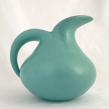 Load image into Gallery viewer, Vintage art deco style teal pitcher vase, hand painted with branches and pink flower blossoms, glazed black on the interior. Produced by Brentleigh Ware, England, circa 1930s. This small pitcher has big style with strong lines! In great vintage condition, free from chips/cracks/repairs, very minor glaze loss on the rim and handle. Marked "Brentleigh Ware, England 75 Samara". Measures 4 1/2 x 5 inches