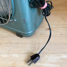 Load image into Gallery viewer, Side detail of vintage ZERO box fan showing original black two-prong power cord bundled with pink tie, teal enamel housing with surface patina