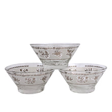Load image into Gallery viewer, A super cool piece of mid-century history in this Hollywood regency style 3-tier chrome relish or snack caddy featuring a leaf medallion and spring handle, with three glass bowls with a pattern of silver birds and botanicals on a frosted band and silver ric rac detail below the rim. Crafted by the Libbey Glass Company, USA, circa 1960s. Wow your guests with this fabulous and practical serving piece for condiments, bar snacks or sundae toppings!