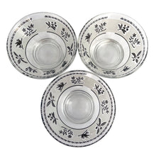 Load image into Gallery viewer, A super cool piece of mid-century history in this Hollywood regency style 3-tier chrome relish or snack caddy featuring a leaf medallion and spring handle, with three glass bowls with a pattern of silver birds and botanicals on a frosted band and silver ric rac detail below the rim. Crafted by the Libbey Glass Company, USA, circa 1960s. Wow your guests with this fabulous and practical serving piece for condiments, bar snacks or sundae toppings!